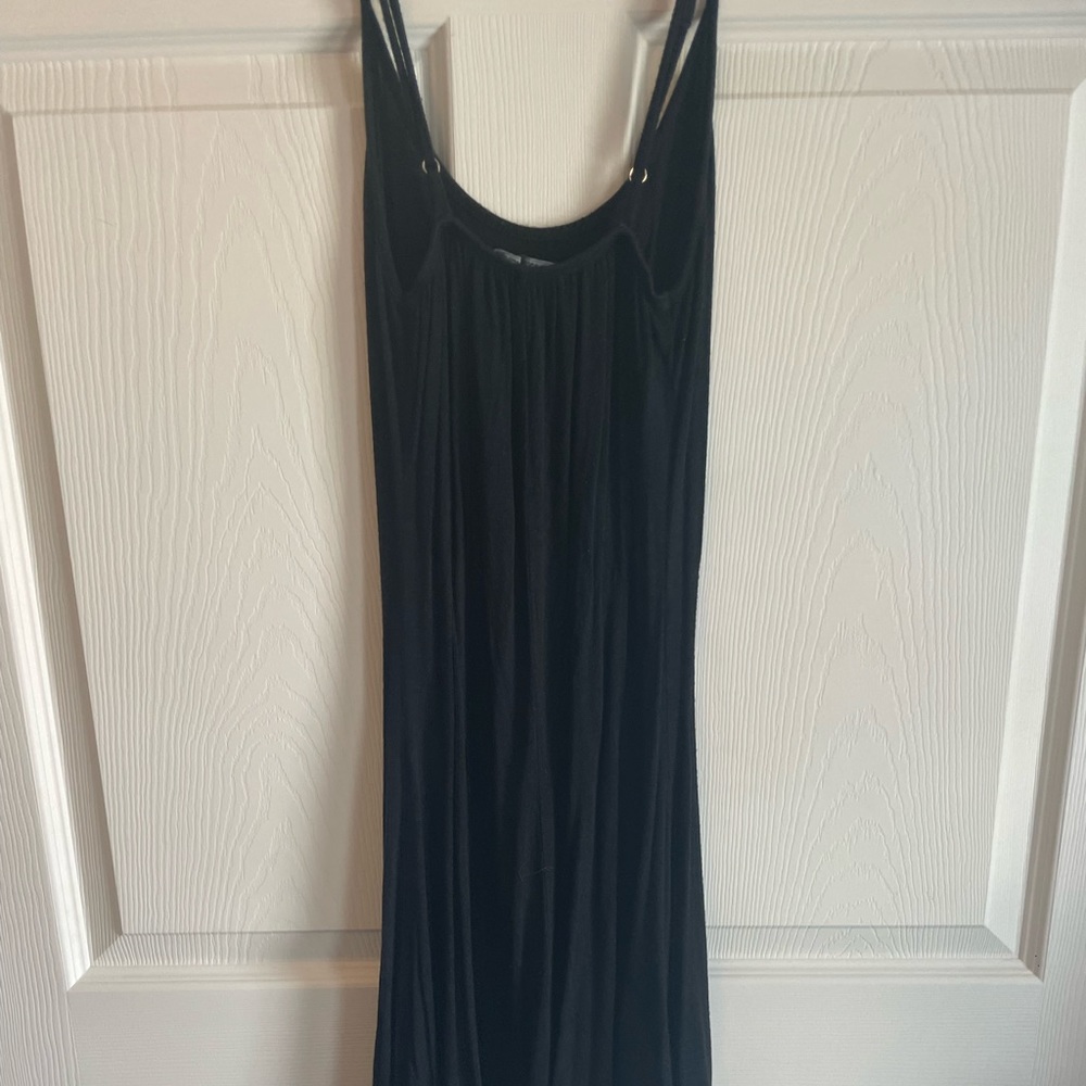 Fitted black mini dress. Loose at the bottom